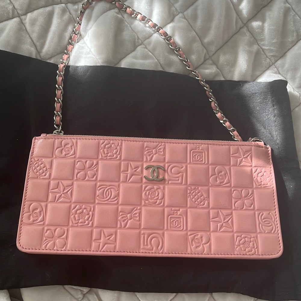 Chanel pink stamped leather pochette bag.